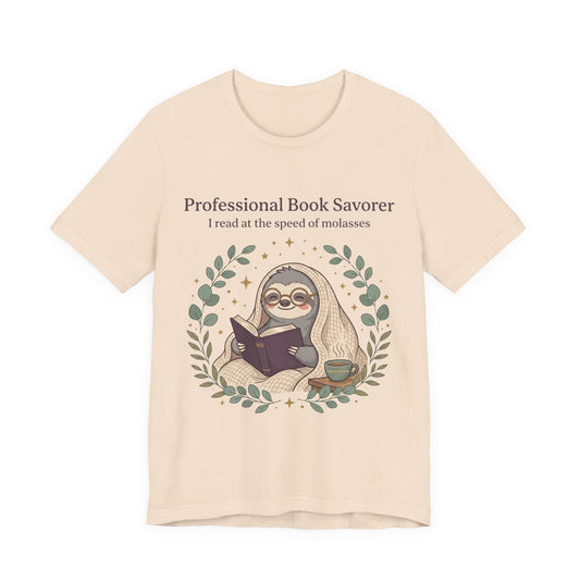 Book Lover Sloth T‑Shirt — "Professional Book Savorer: I read at the speed of molasses"
